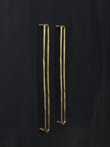 A left side view of the natural brass colored luxury closet pull bar