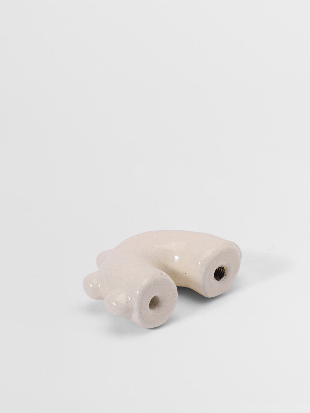 White arc shaped pull on a light gray background