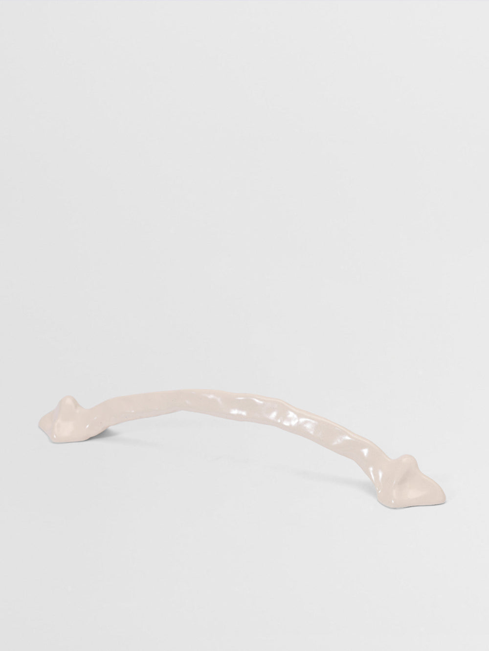 White large pull handle on a light gray background