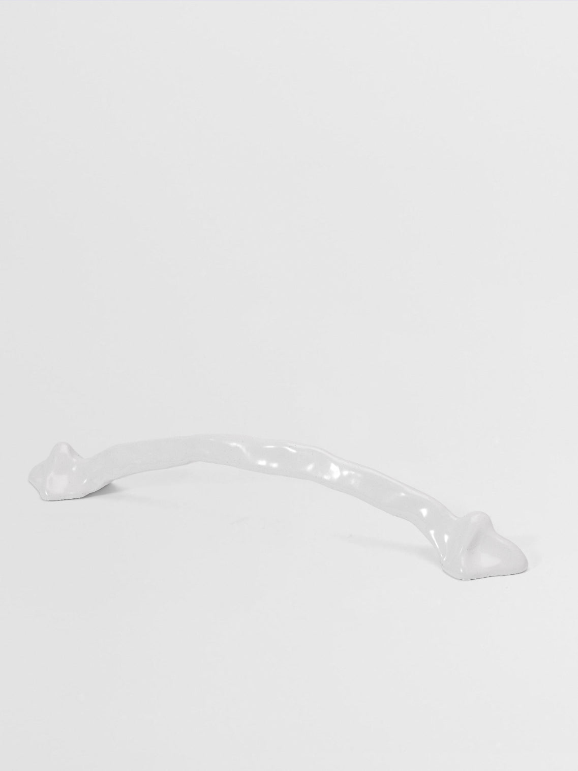 White large pull handle on a light gray background