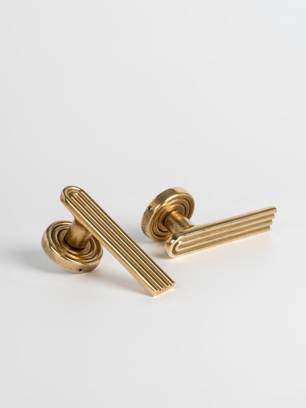 Two sets of brass finish passage door handle