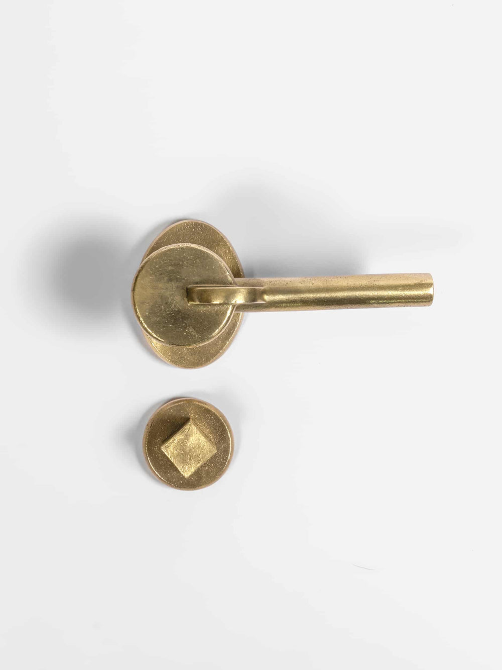 A top view of a natural brass Finish privacy door lever set