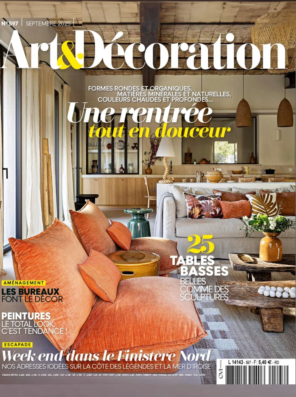 Magazine cover of Art & Décoration featuring a modern living room with orange sofa and decor elements.
