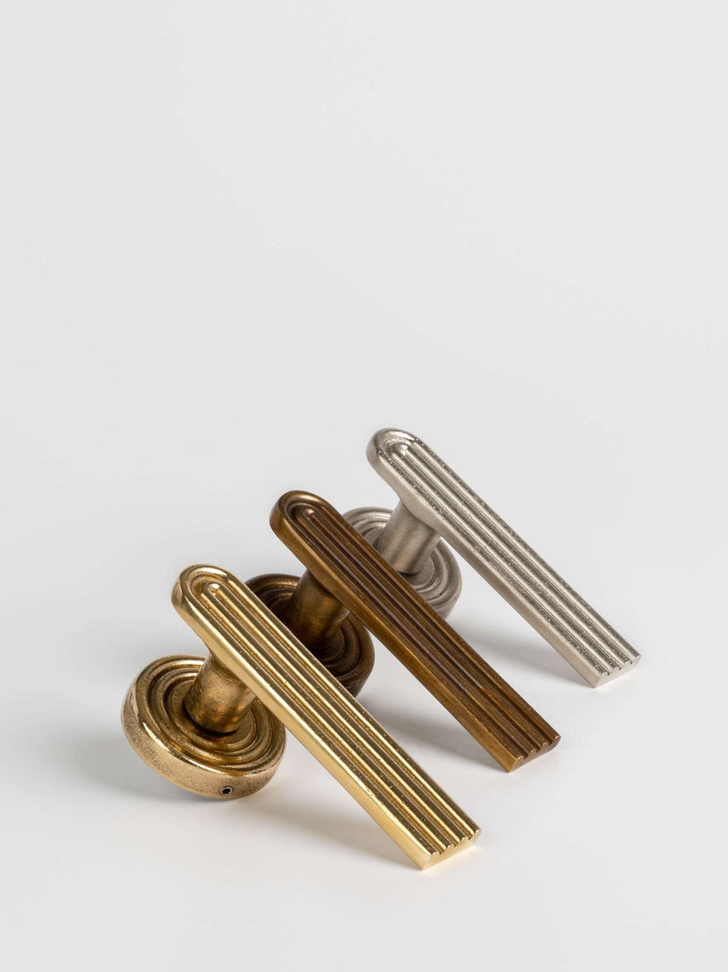Three sets of brass, bronze, satin nickel passage door handle