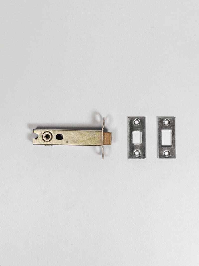 A top view of a polished nickel deadbolt latch