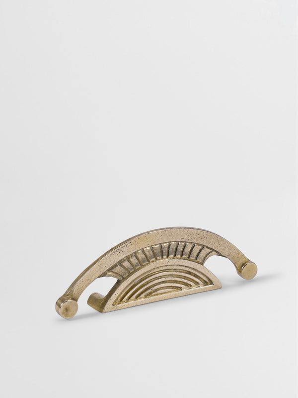 Right side view of the brass cabinet pull handle