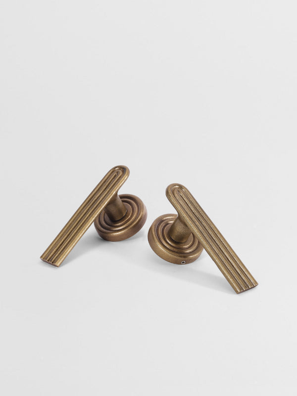 Two sets of brass finish passage door handle