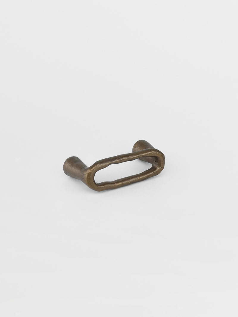 Left side view of a bronze drawer pull