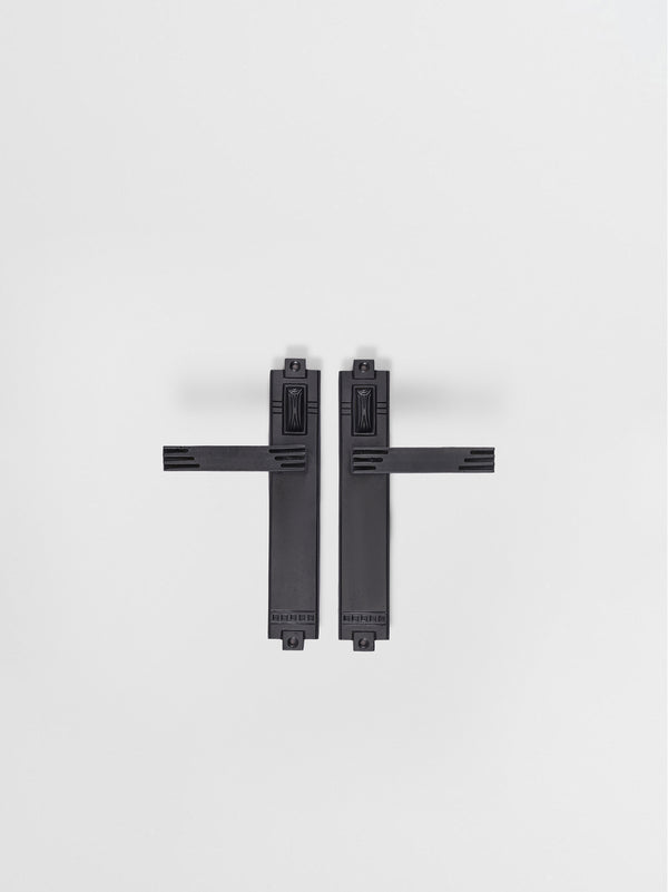 A left side and right view of a natural brass finish passage door lever set