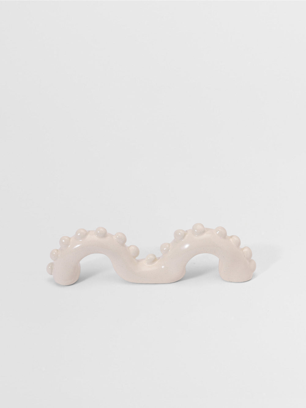 White organic shaped pull on a light gray background