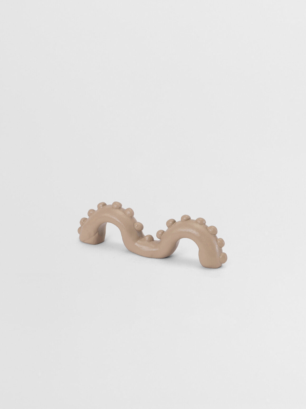 Beige -organic shaped pull on a light gray background