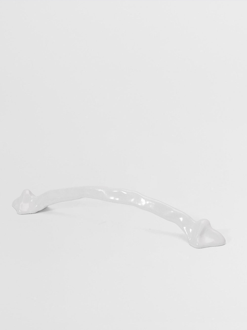 White large pull handle on a light gray background