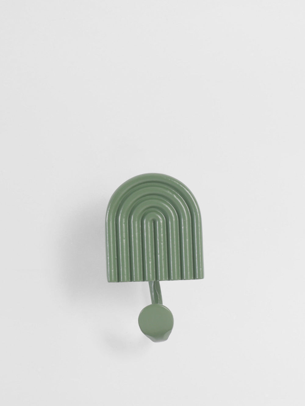 Green wall hook with arch design on a white background