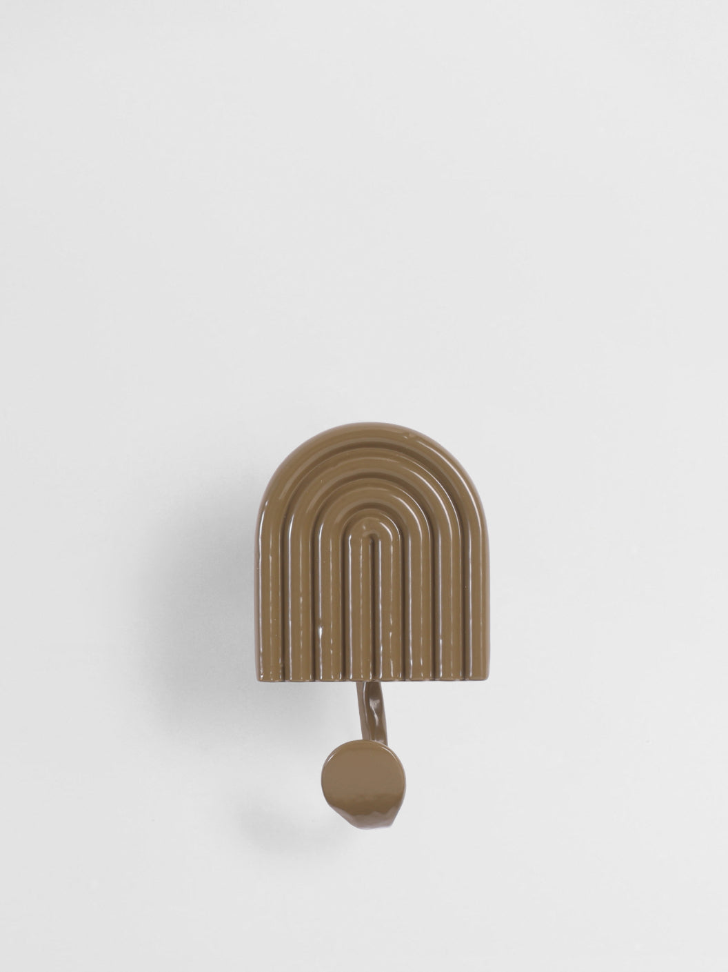 Brown arch-shaped hook on a light gray background