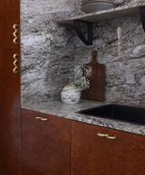 Forme N°39 brass pulls installed on kitchen cabinetry