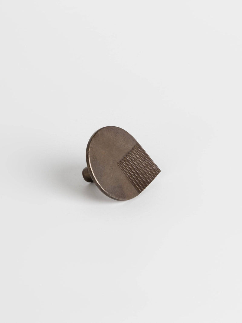 Left side view of a carbon black colored oversized door drawer pull