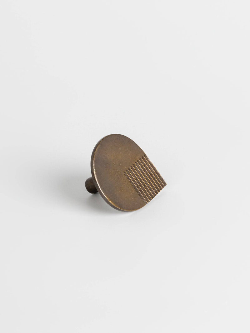 Left side view of a bronze colored oversized door drawer pull