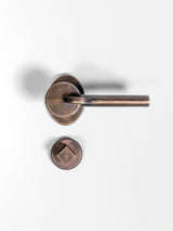 A top view of a bronze Finish privacy door lever set