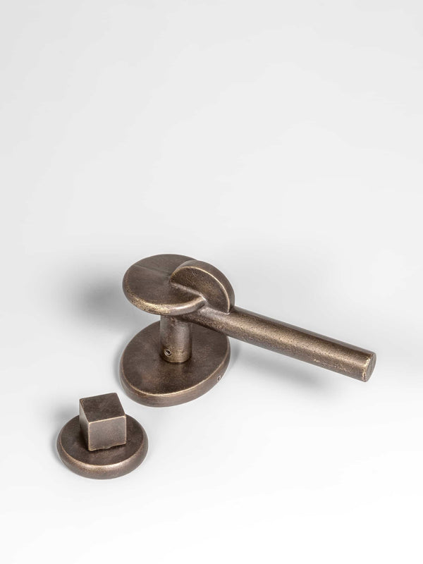 A top view of a natural brass Finish privacy door lever set