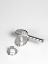A left side view of a satin nickel finish privacy door lever set   
