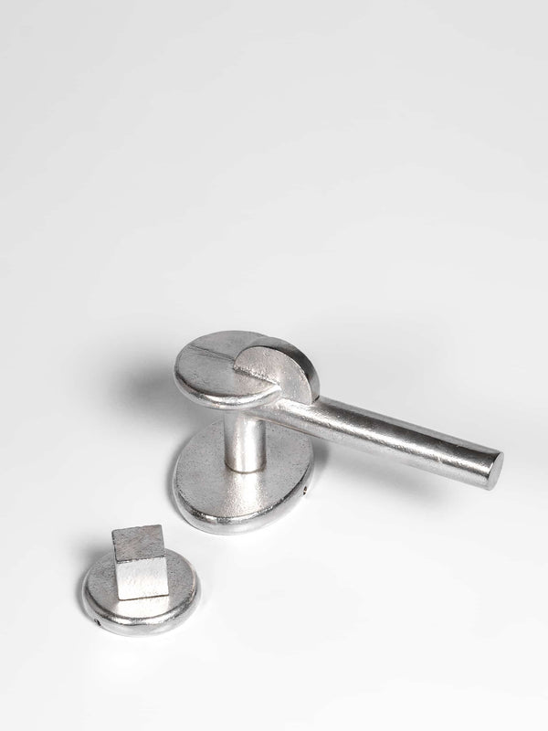 A top view of a natural brass Finish privacy door lever set