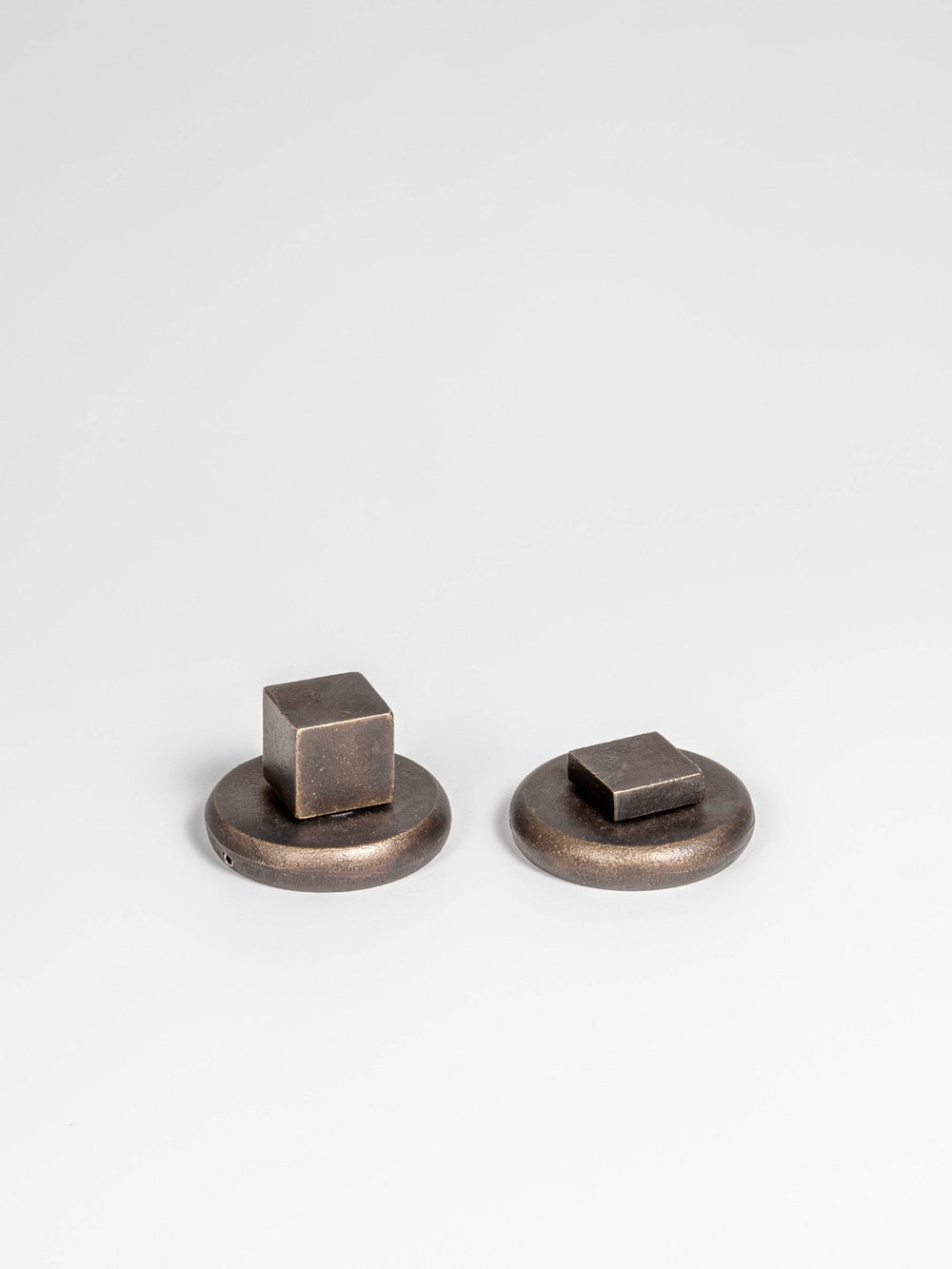 A front side view of a bronze finish privacy door lever set 