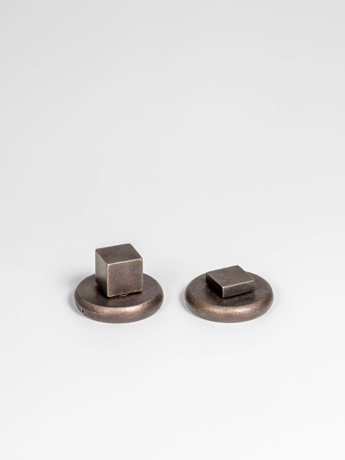 A front side view of a bronze finish privacy door lever set 