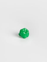  A left side view of a green colored wall hook 