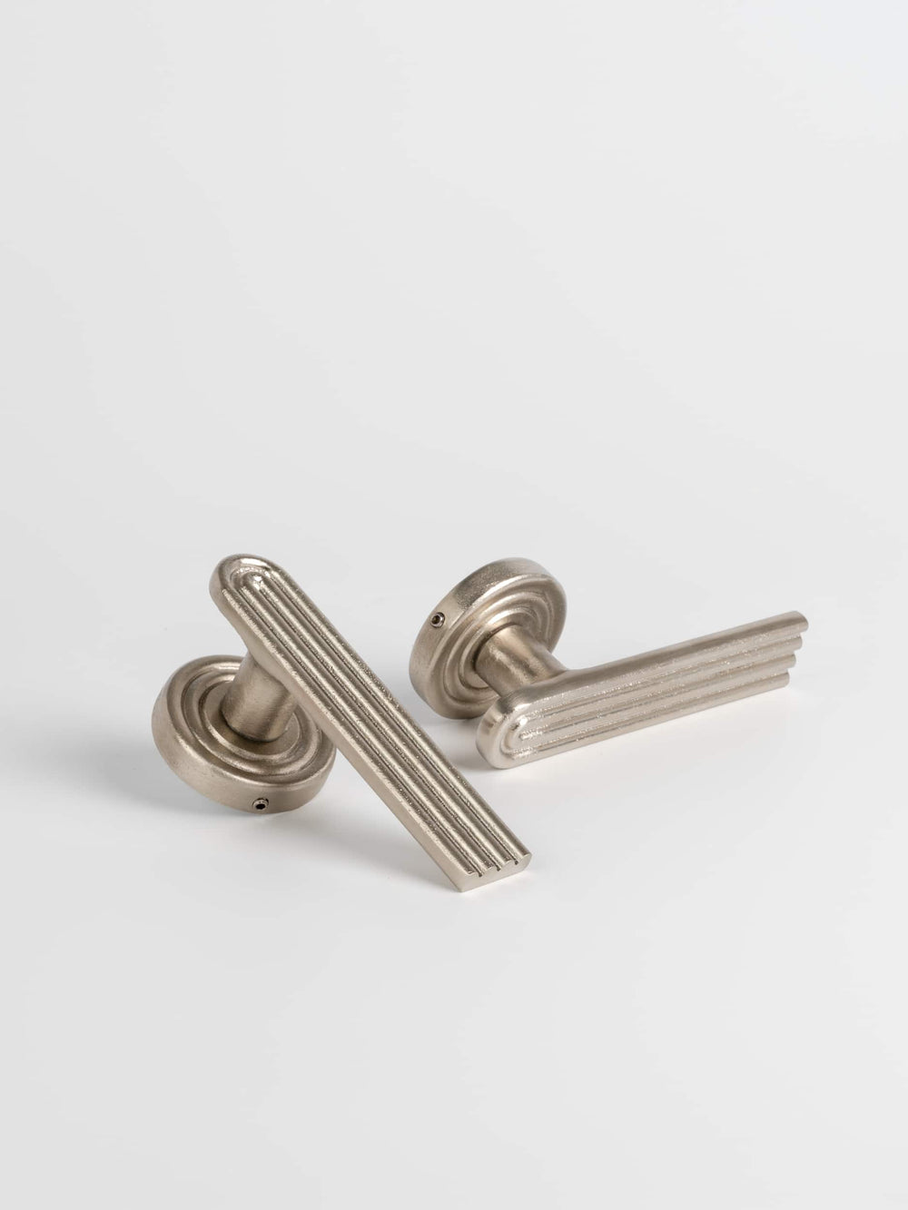 Two sets of satin nickel passage door handle